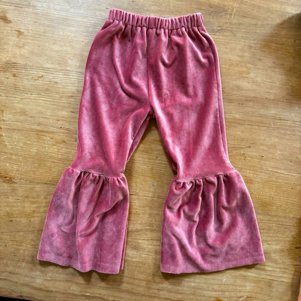 Soft stretchy bell bottoms. Dusty rose color